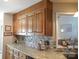 Kitchen with wood cabinets, granite counters, and tile backsplash at 4819 Vander Ln # 54, Monroe, NC 28110