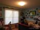 Home office with desk, window blinds, and vintage car decor at 4819 Vander Ln # 54, Monroe, NC 28110