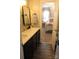 Double vanity bathroom with dark cabinets and a view of bedroom at 503 Bridgestone Ct, Gastonia, NC 28056