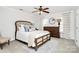 Comfortable bedroom with a large bed, wooden dresser, and neutral decor at 503 Bridgestone Ct, Gastonia, NC 28056