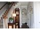 Elegant entryway with staircase, hardwood floors, and clock at 503 Bridgestone Ct, Gastonia, NC 28056