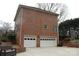 Two-car garage with brick exterior and driveway at 503 Bridgestone Ct, Gastonia, NC 28056