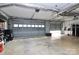 Spacious garage with concrete floors, storage shelves, and industrial-style exposed ceiling at 503 Bridgestone Ct, Gastonia, NC 28056