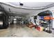 Functional garage with a variety of tools and equipment organized on shelves and walls at 503 Bridgestone Ct, Gastonia, NC 28056