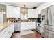 Well-equipped kitchen featuring stainless steel appliances, granite countertops, and white cabinetry at 503 Bridgestone Ct, Gastonia, NC 28056