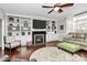 Spacious living room featuring a fireplace and built-in bookshelves at 503 Bridgestone Ct, Gastonia, NC 28056