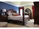 Spacious main bedroom with a large four-poster bed and ensuite access at 503 Bridgestone Ct, Gastonia, NC 28056