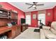 Bright office featuring a desk, television, exercise bike, and natural light from two windows at 503 Bridgestone Ct, Gastonia, NC 28056