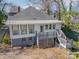 House with a deck, detached garage, and fenced backyard at 506 S Chester St, Gastonia, NC 28052