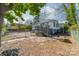 Landscaped backyard with flagstone path and detached garage at 506 S Chester St, Gastonia, NC 28052