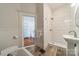 Modern bathroom with a walk-in shower and white tile at 506 S Chester St, Gastonia, NC 28052