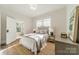 Bright bedroom with a queen-size bed and natural light at 506 S Chester St, Gastonia, NC 28052