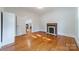 Simple bedroom with hardwood floors and a fireplace at 506 S Chester St, Gastonia, NC 28052