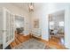 Bright entryway with hardwood floors, showcasing views of the living and dining areas at 506 S Chester St, Gastonia, NC 28052