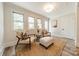 Relaxing sunroom with comfy chairs and natural light at 506 S Chester St, Gastonia, NC 28052