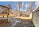 View of the backyard, deck, and wooden fence at 5107 Lakeview Rd, Charlotte, NC 28216