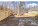 Fenced backyard with a view of the wooded area at 5107 Lakeview Rd, Charlotte, NC 28216