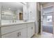 Modern bathroom with double vanity and a walk-in shower at 5107 Lakeview Rd, Charlotte, NC 28216