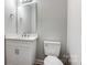 Clean bathroom with white vanity and updated fixtures at 5107 Lakeview Rd, Charlotte, NC 28216