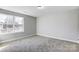 Bright bedroom with carpeted floor and a window at 5107 Lakeview Rd, Charlotte, NC 28216