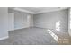 Spacious bedroom with carpet flooring and access to bathroom at 5107 Lakeview Rd, Charlotte, NC 28216