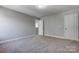 Spacious bedroom featuring a window, closet, and carpet flooring at 5107 Lakeview Rd, Charlotte, NC 28216