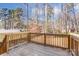 Wooden deck overlooks a fenced backyard with trees at 5107 Lakeview Rd, Charlotte, NC 28216