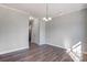 Bright dining room with hardwood floors and a window at 5107 Lakeview Rd, Charlotte, NC 28216