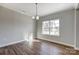 Bright dining room with hardwood floors and a window at 5107 Lakeview Rd, Charlotte, NC 28216