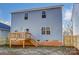 Rear view of house with light blue siding and deck at 5107 Lakeview Rd, Charlotte, NC 28216