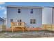 Rear view of house, showcasing light blue siding and deck at 5107 Lakeview Rd, Charlotte, NC 28216