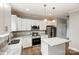 Modern kitchen with white cabinets, granite countertops, and stainless steel appliances at 5107 Lakeview Rd, Charlotte, NC 28216