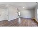 Spacious living room with hardwood floors and a ceiling fan at 5107 Lakeview Rd, Charlotte, NC 28216