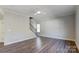 Spacious living room with hardwood floors and a ceiling fan at 5107 Lakeview Rd, Charlotte, NC 28216