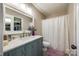 Clean bathroom with a teal vanity and a shower/tub combo at 517 Fenton Pl, Rock Hill, SC 29732