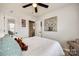 Bedroom with queen bed, ceiling fan, and large wall art at 517 Fenton Pl, Rock Hill, SC 29732