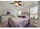 Bedroom with a lavender bedding set, ceiling fan, and antique-style furniture at 517 Fenton Pl, Rock Hill, SC 29732