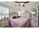 Spacious bedroom with a purple comforter and ensuite access at 517 Fenton Pl, Rock Hill, SC 29732