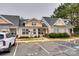 Townhouse with light beige exterior and a small front yard at 517 Fenton Pl, Rock Hill, SC 29732