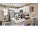 Modern white kitchen with stainless steel appliances and granite countertops at 517 Fenton Pl, Rock Hill, SC 29732