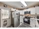 Bright kitchen with stainless steel appliances and white cabinets at 517 Fenton Pl, Rock Hill, SC 29732