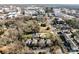 An aerial view showcasing the neighborhood's layout, with buildings, tree coverage, and street patterns at 5617 Fairview Rd # 9, Charlotte, NC 28209