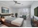 Main bedroom with large window and modern furniture at 5617 Fairview Rd # 9, Charlotte, NC 28209