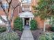 Charming brick building entrance with lush landscaping and direct access to units at 5617 Fairview Rd # 9, Charlotte, NC 28209