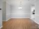 Simple dining room with hardwood floors at 5617 Fairview Rd # 9, Charlotte, NC 28209