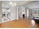 Open-concept living room features hardwood floors, a fireplace, and natural light at 5617 Fairview Rd # 9, Charlotte, NC 28209