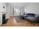 Living room with hardwood floors and fireplace at 5617 Fairview Rd # 9, Charlotte, NC 28209