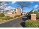 Brick townhouses with landscaping, entrance, and a sign that says Quail Hill at 5915 Quail Hollow Rd # E, Charlotte, NC 28210