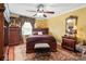 Spacious bedroom with hardwood floors and wood furniture at 5915 Quail Hollow Rd # E, Charlotte, NC 28210