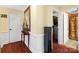 Bright hallway with hardwood floors and access to bedrooms at 5915 Quail Hollow Rd # E, Charlotte, NC 28210